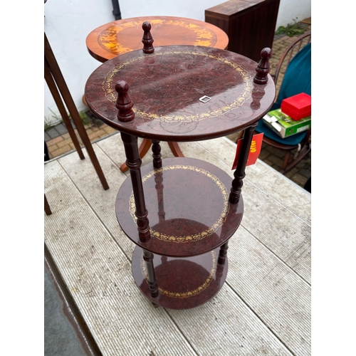 45 - Three-tier wooden side table with decorative inlay and slender turned supports, suitable for home de... 