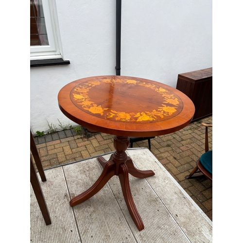 46 - Round wood table with inlaid floral design, pedestal base.