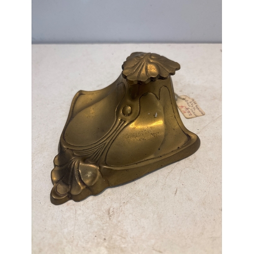 57 - Art Nouveau brass inkwell with ornate floral details and hinged lid. Features wear and patina consis... 