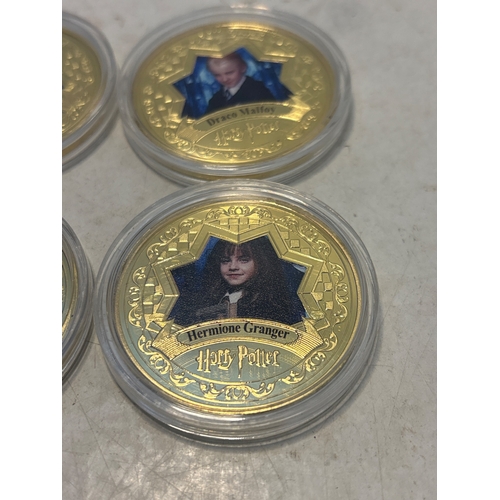 84 - Five Harry Potter-themed gold-tone coins featuring imagery of popular characters. Coins are encased ... 