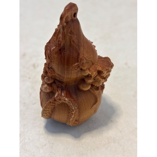 93 - Carved wooden ornament depicting detailed design, 3D carving.