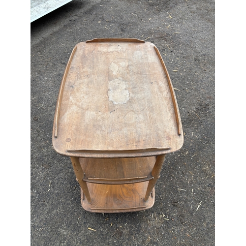 113 - Three-tier ercol wooden cart with natural finish and raised edges.