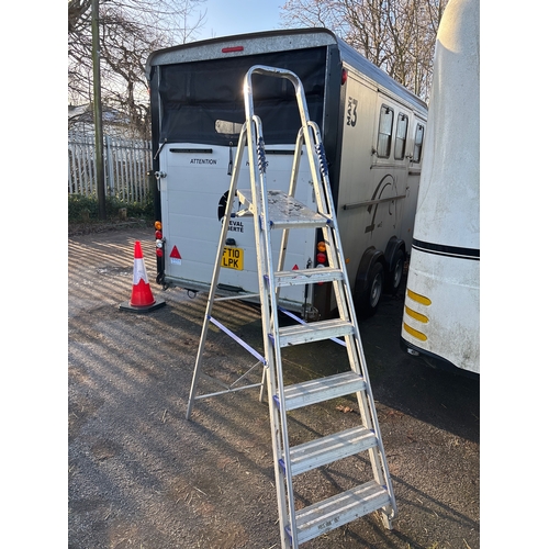 114 - Aluminum step ladder with six steps and safety features not postable.