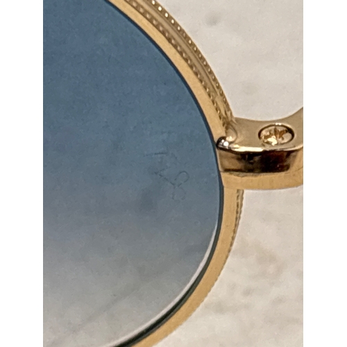 155 - Ray-Ban oval sunglasses with gold-tone frames, blue gradient lenses, and size 54?21. Marked on insid... 