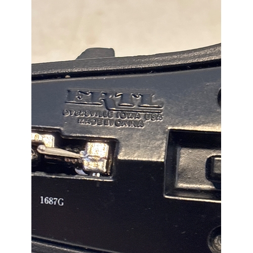 164 - Ertl black diecast jet model with USAF markings, marked 1687G, made in China, displays wear.