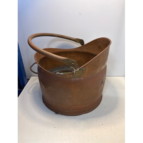86 - Copper  bucket with handle, surface wear visible.