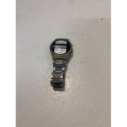 94 - Lambda digital wristwatch with metal strap and blue face.