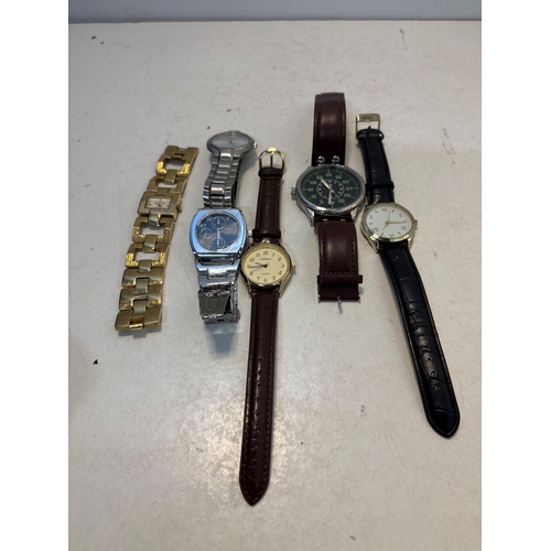 95 - Five assorted wristwatches, including brands such as Armitron and Citizen. Includes various straps a... 