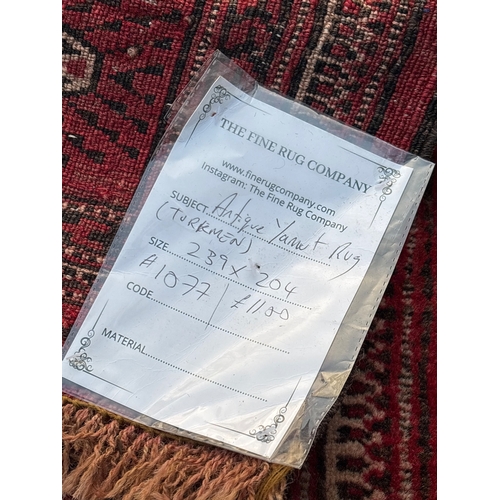 187 - Handmade Turkmen rug, red with geometric motifs, 233x204 cm.