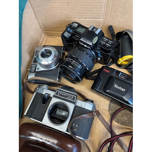 193 - Vintage cameras and accessories including Praktica, Minolta, Vivitar, Ilford leather cases, and more... 