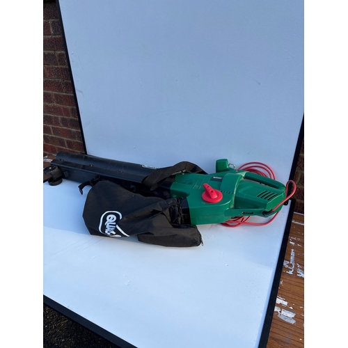 196 - Green electric leaf blower with black bag and red cord not postable.