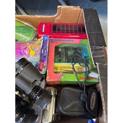 197 - Items including toys, binoculars, and a microscope.
