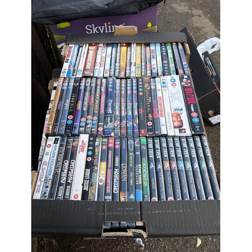 Large mixed collection of DVDs in various genres and series.
