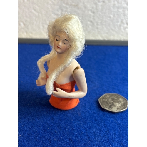 2 - Circa 1920 German bisque half doll with white hair.