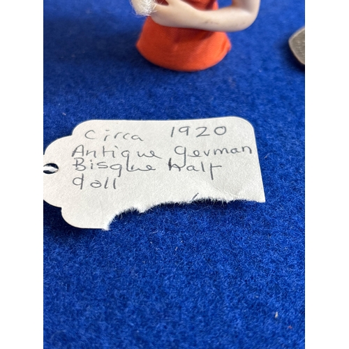 2 - Circa 1920 German bisque half doll with white hair.