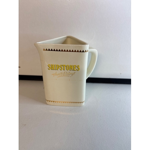 12 - Shipstones ceramic pitcher with gold accents.