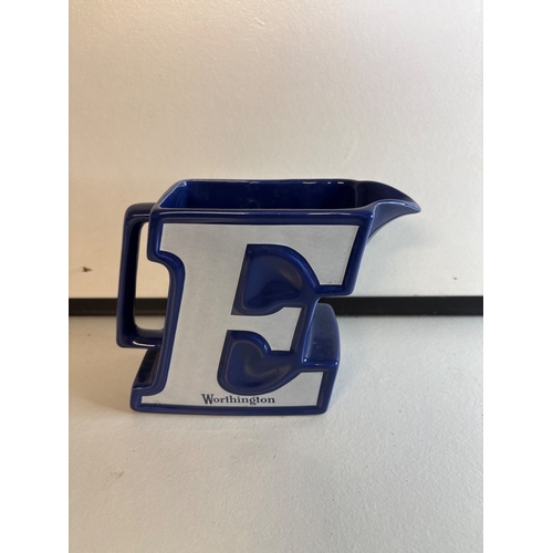 13 - Blue ceramic pitcher with Worthington logo.