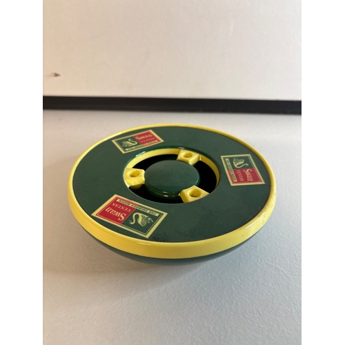 16 - Green Presidium melamine swan vester ash tray with yellow trim and logos.