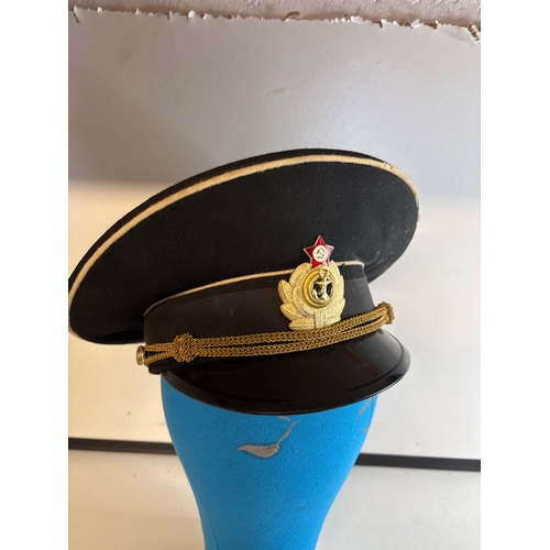 22 - Russian military peaked cap with badge and interior mark.