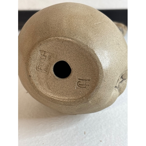 24 - Ceramic poole figurine of a mouse atop a textured sphere.
