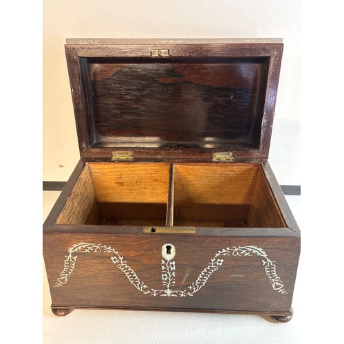 29 - Wooden tea caddy with inlay design and two compartments.