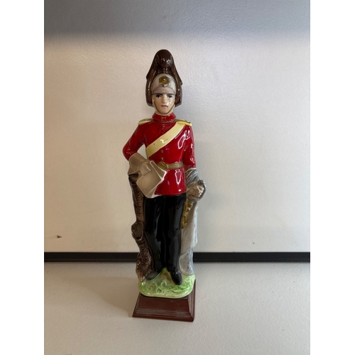 35 - Ceramic soldier figurine in red uniform decanter