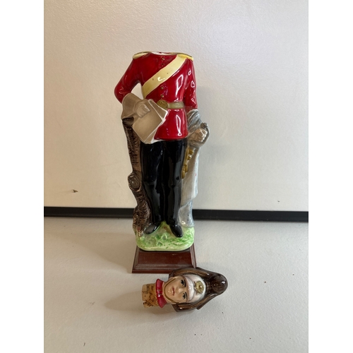 35 - Ceramic soldier figurine in red uniform decanter