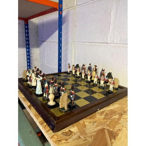 39 - chess set with painted figurine pieces.