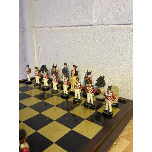 39 - chess set with painted figurine pieces.
