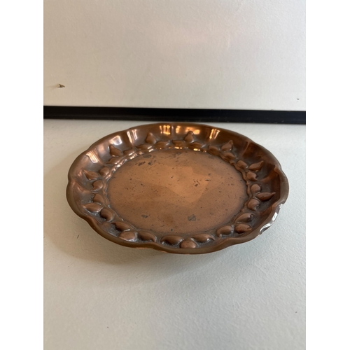 41 - Circular copper dish with scalloped edges.