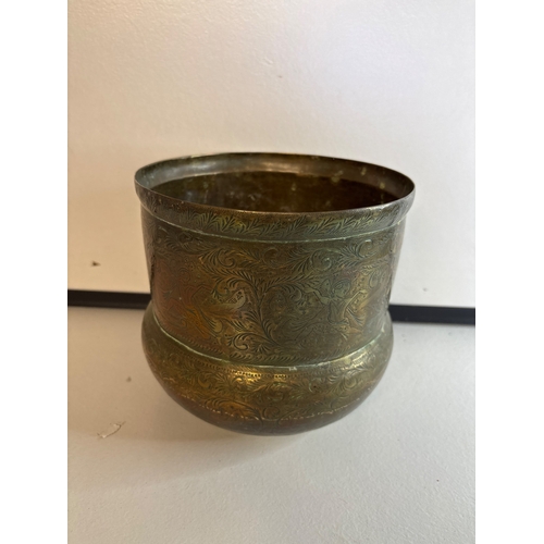 47 - Engraved brass planter  with intricate decorative patterns.