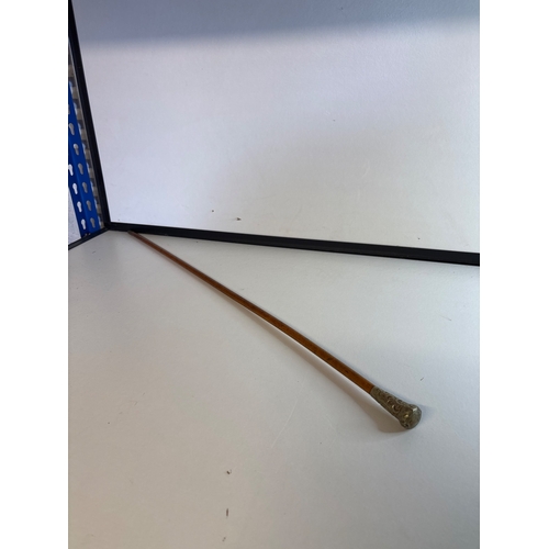 54 - Decorative wood swagger stick with ornate silver handle.