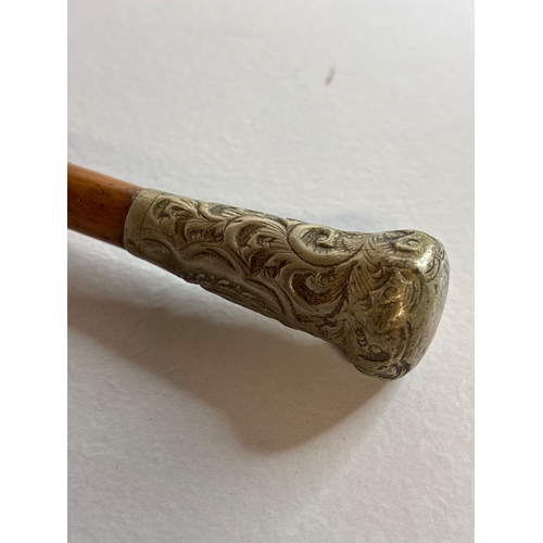 54 - Decorative wood swagger stick with ornate silver handle.