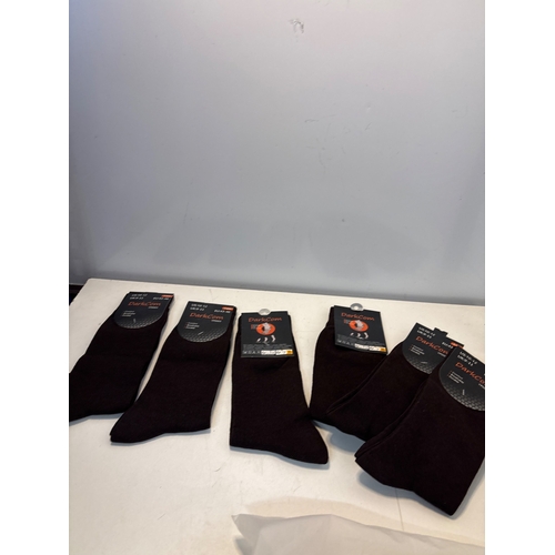 112 - Five pairs of new black socks with tags.