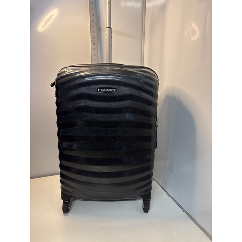 62 - Samsonite black patterned spinner luggage with wheels.