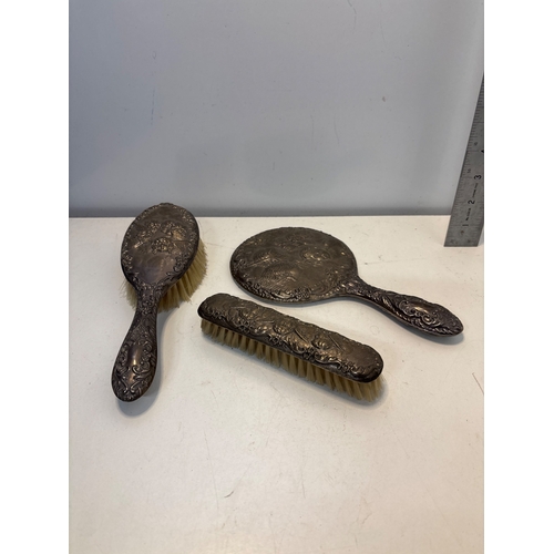 82 - Sterling silver vanity set with mirror and brushes.