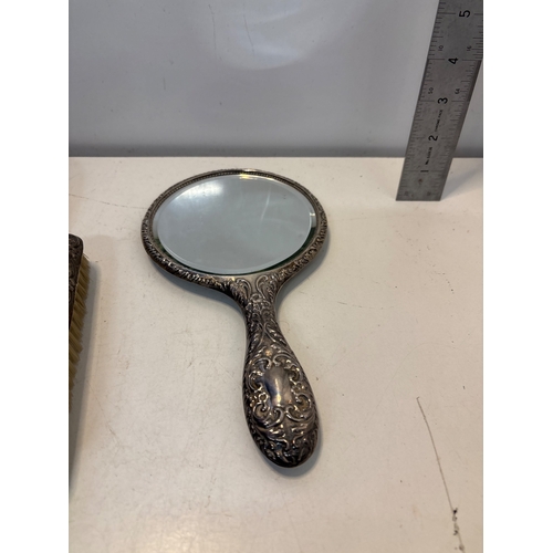82 - Sterling silver vanity set with mirror and brushes.
