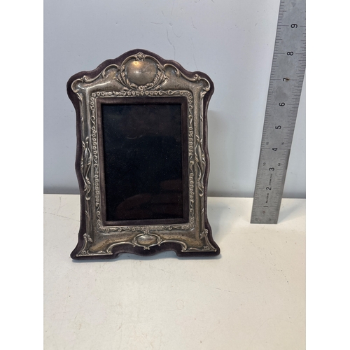 83 - Sterling silver photo frame with hallmarks, 7-inch size.