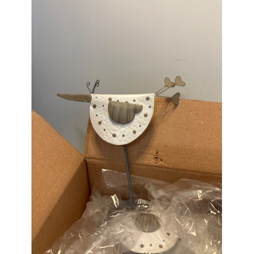 91 - 6 Metal bird sculptures with white details, boxed.