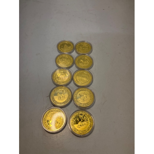 98 - 10 Zodiac coins in protective cases.