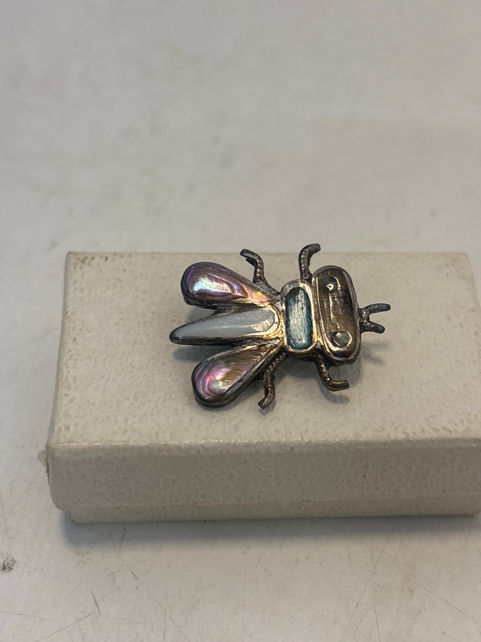 Bee-shaped brooch crafted from sterling silver, featuring mother of ...