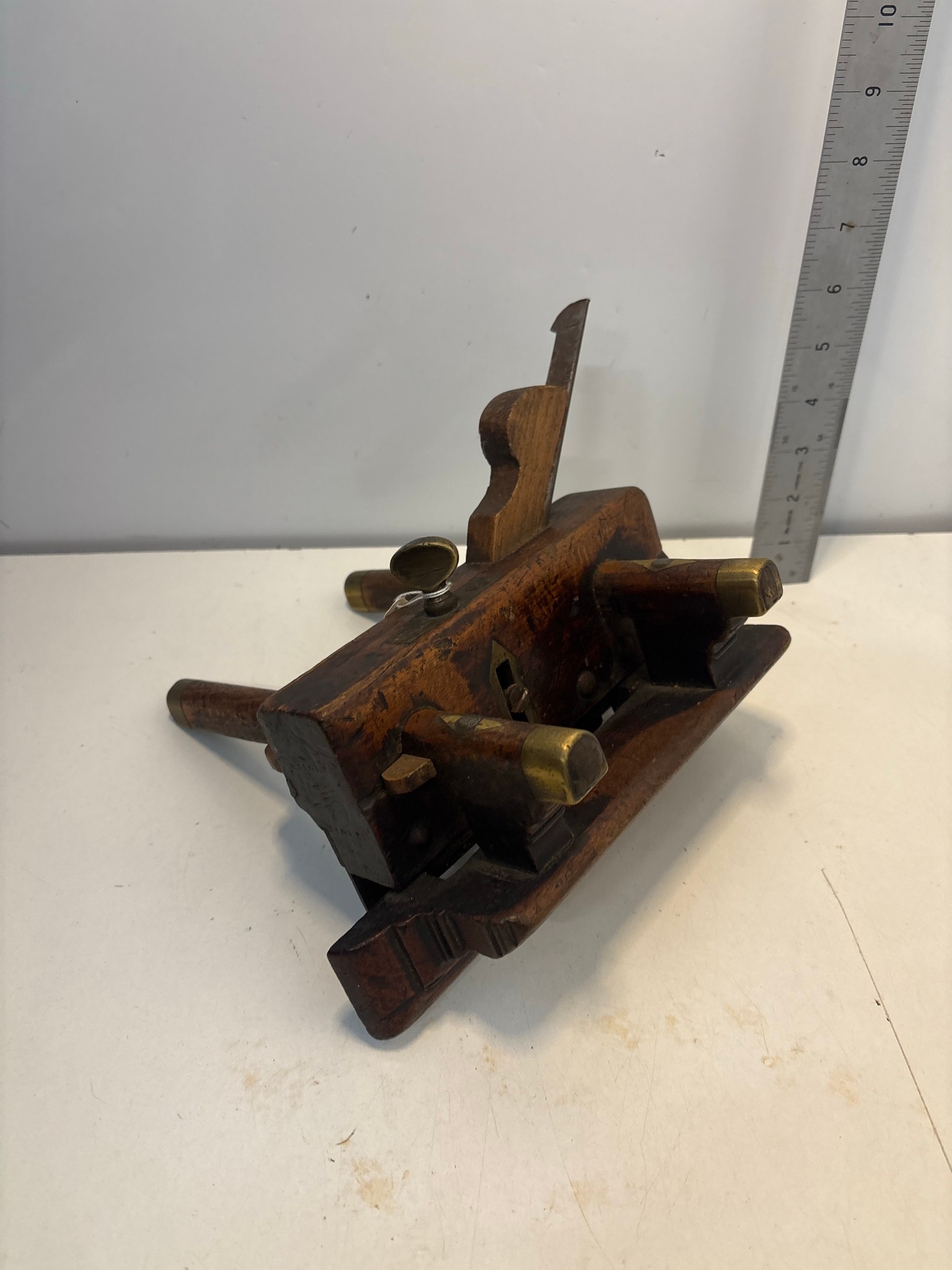 Wood and brass plow plane featuring adjustable arms and brass fittings ...