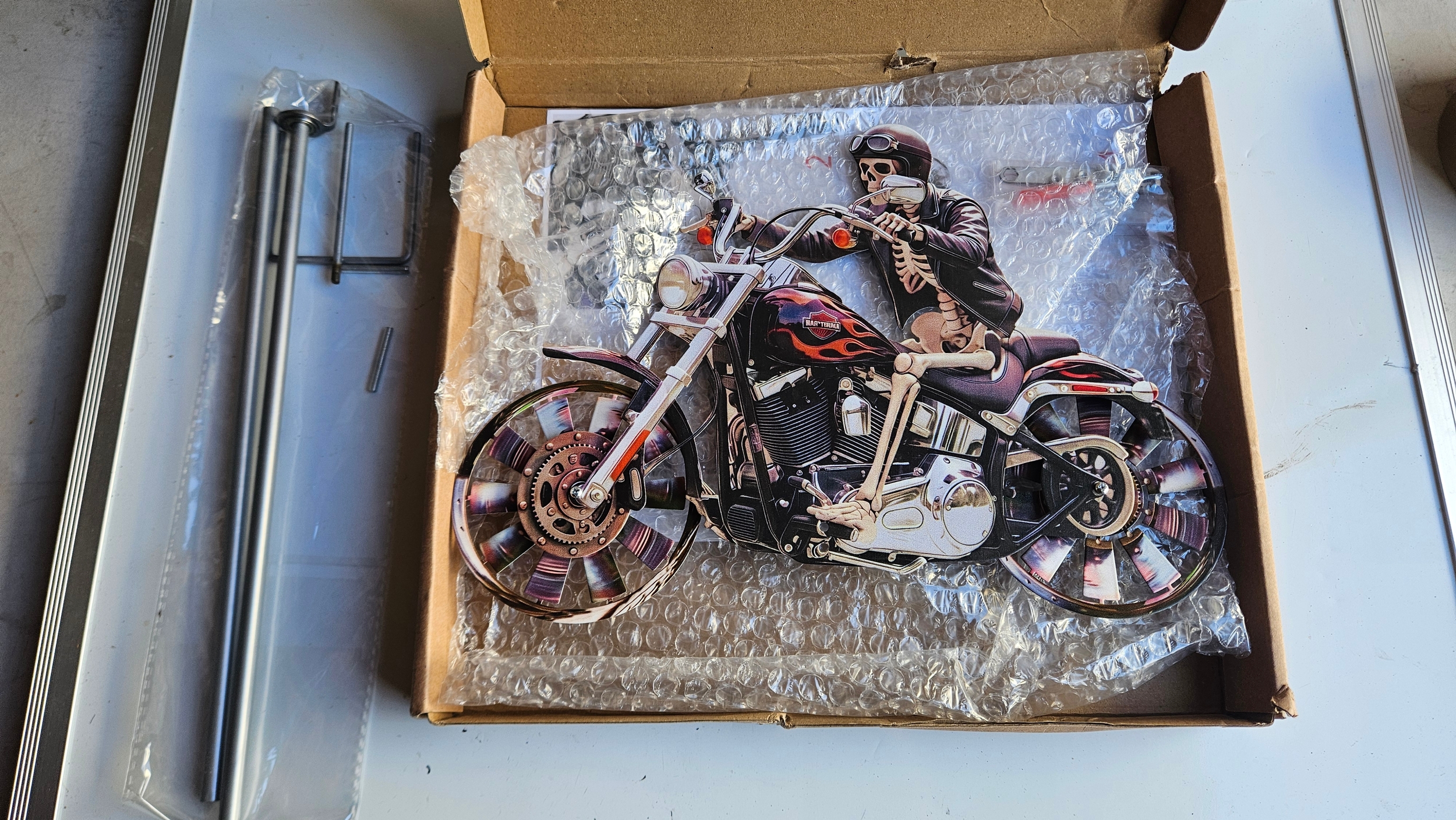 2D metal skeleton motorcycle wind spinner and garden stake.