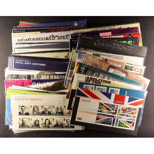 1407 - GB.ELIZABETH II COMMEMORATIVE PRESENTATION PACKS 1971 - 2021. Unsorted packs in an album and loose. ... 