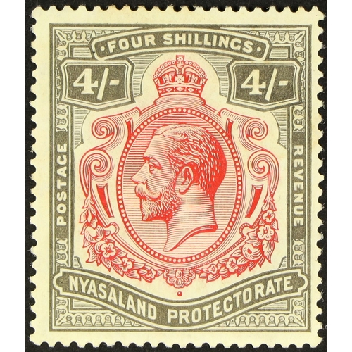 526 - NYASALAND 1921-33 4s carmine and black, break in scroll, SG 111a, mint, some gum toning. Cat. £250.