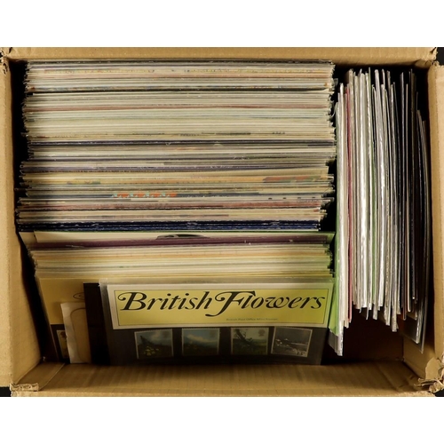 1072 - GB.ELIZABETH II PRESENTATION PACKS A shoe box filled with presentation packs from the 1970's - 1990'... 