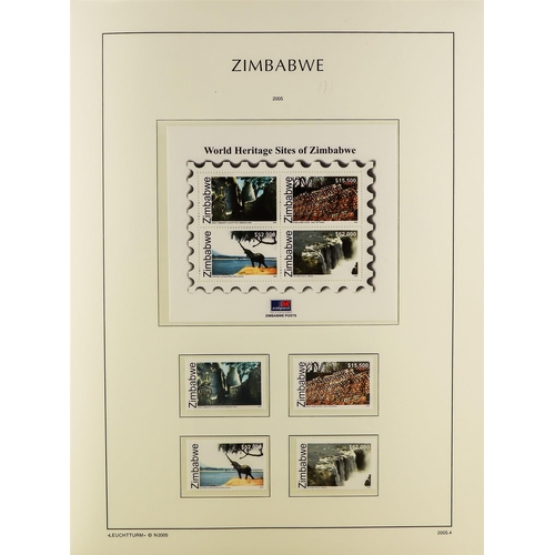 948 - ZIMBABWE 1980-2009 NEVER HINGED MINT COLLECTION in a hingeless Lighthouse album with slipcase, a com... 