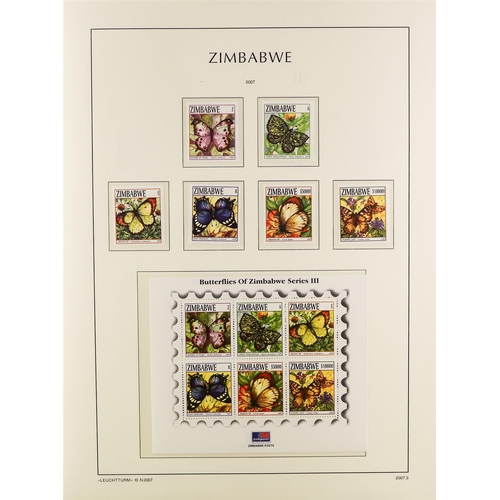 948 - ZIMBABWE 1980-2009 NEVER HINGED MINT COLLECTION in a hingeless Lighthouse album with slipcase, a com... 