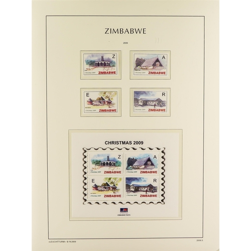 948 - ZIMBABWE 1980-2009 NEVER HINGED MINT COLLECTION in a hingeless Lighthouse album with slipcase, a com... 