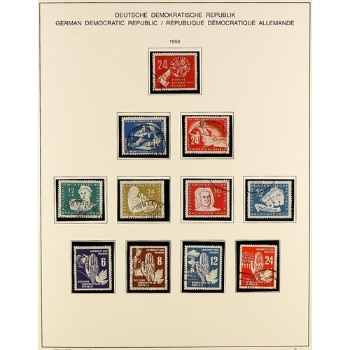 529 - GERMANY EAST 1949-90 USED COLLECTION IN THREE SCHAUBEK ALBUMS WITH SLIPCASES well filled incl. many ... 